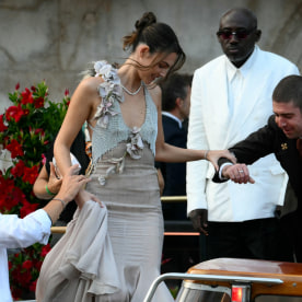 Italian model Vittoria Ceretti (C), British fashion editor Edward Enninful and Indian philanthropist Natasha Poonawalla (2ndR) leave the Gritti Palace Hotel ahead of the wedding of Amazon's founder Jeff Bezos with Lauren Sanchez in Venice on June 26, 2026. Celebrities in superyachts sail into Venice this week for the three-day wedding party of Amazon tycoon Jeff Bezos and Lauren Sanchez, despite irate locals who say the UNESCO city is no billionaire's playground. The tech magnate and journalist have reportedly invited about 200 guests to their multi-million dollar nuptials in the Italian city, which are expected to kick off on June 26 and end Saturday with a ceremony at a secret location.