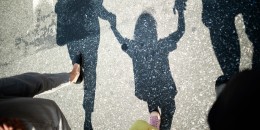 Mother, Father And Son Holding Hands.